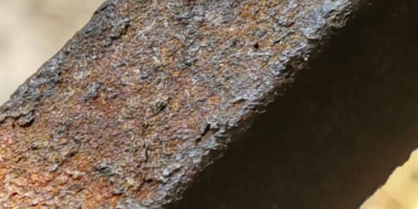 Close-up photo of a rebar with corrosion